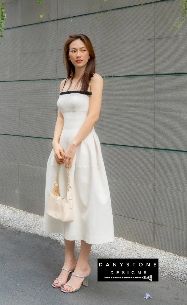 Model showcasing chic floral 2-strap flared dress in white