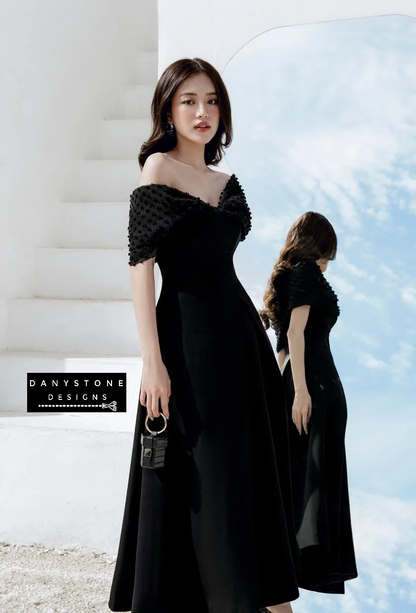 Detailed look at chiffon sleeves on off-shoulder flared dress in black