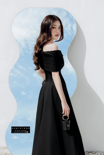 Elegant off-shoulder bow flared dress with chiffon in black - standing pose