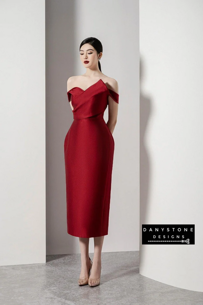 Model showcasing Belle of the Ball off-shoulder dress with puffy skirt in red