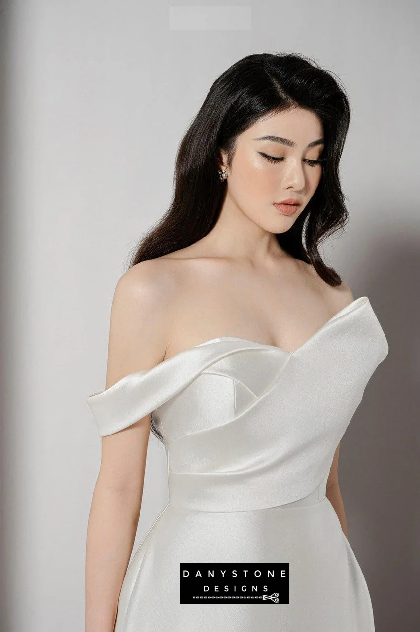 Belle of the Ball off-shoulder dress with puffy skirt in white - standing pose