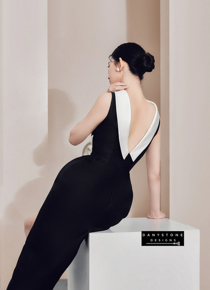 Back view of sophisticated black dress with white collar and back V-slit