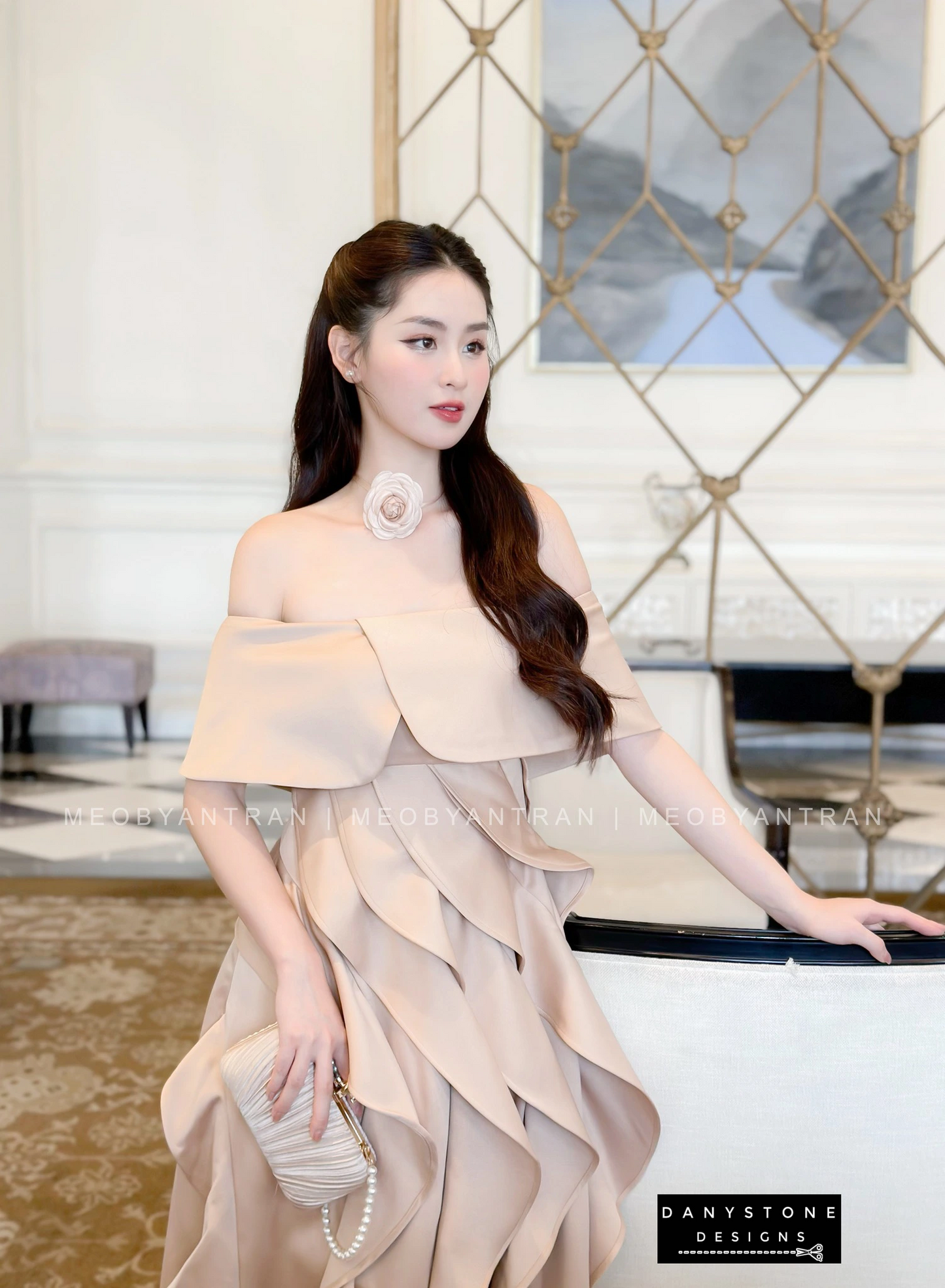 Model Posing in Nude Off-Shoulder Ruffled Skirt Dress with Silver Heels