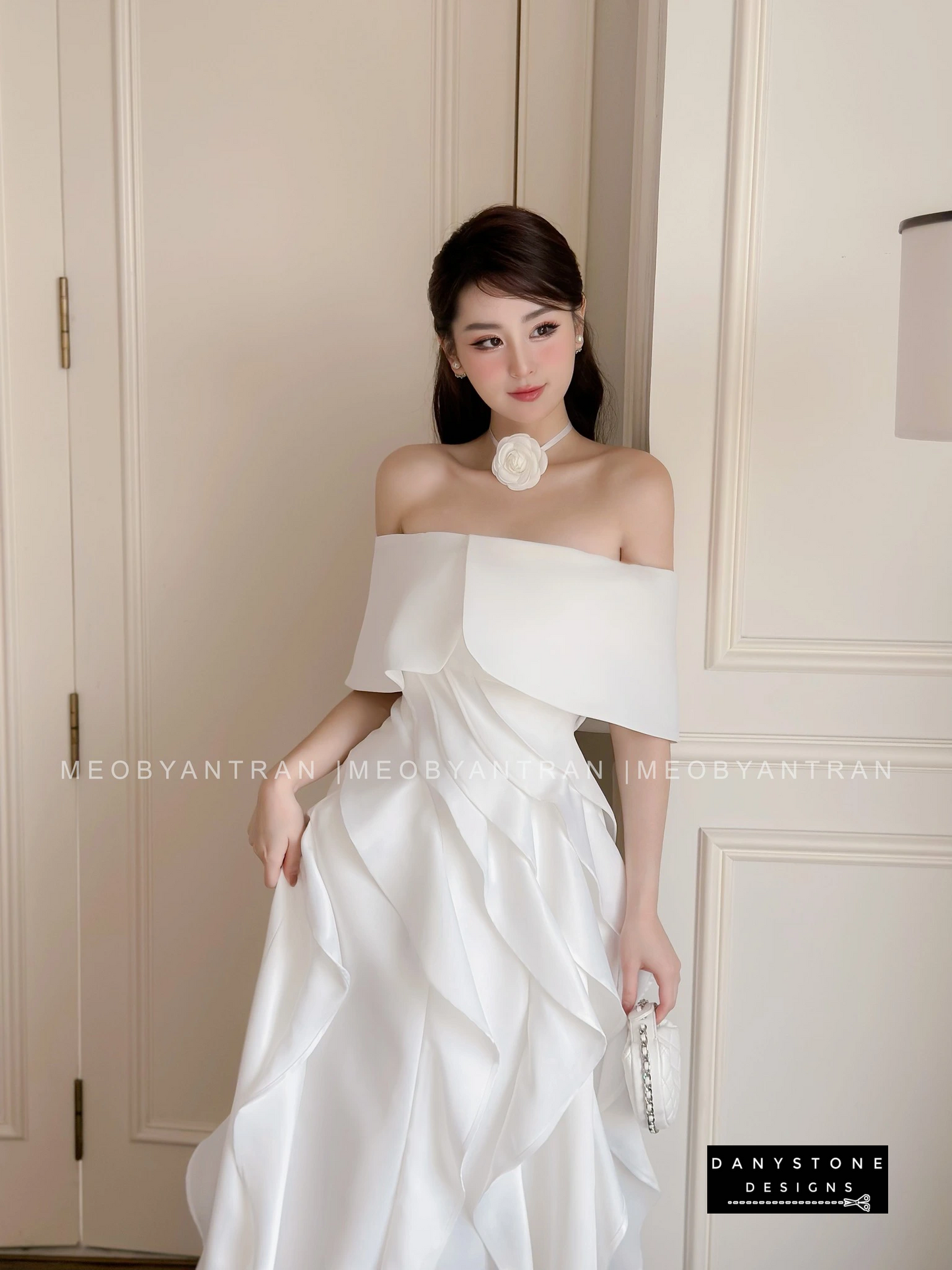 Model in White Off-Shoulder Ruffled Skirt Dress Highlighting Silhouette