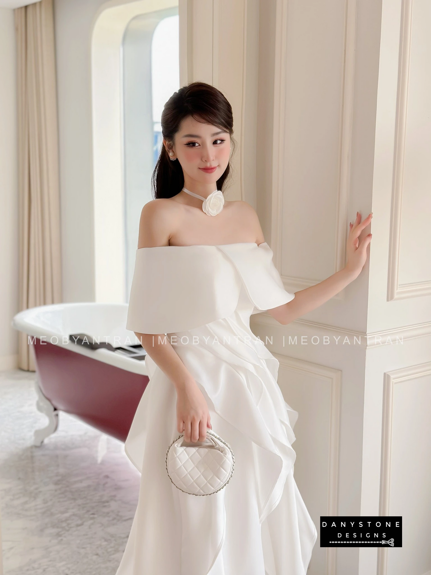 Model Wearing white Off-Shoulder Ruffled Skirt Dress in Luxurious Setting