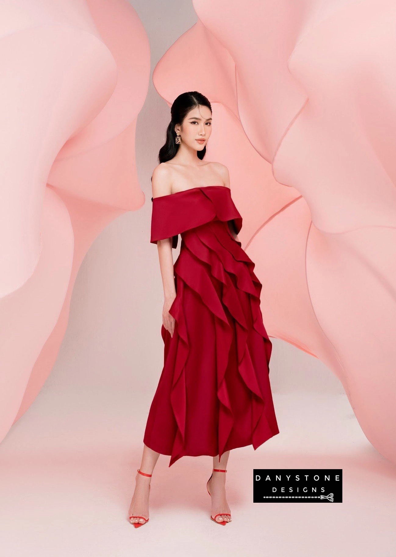 Model Wearing Red Off-Shoulder Ruffled Skirt Dress in Elegant Setting