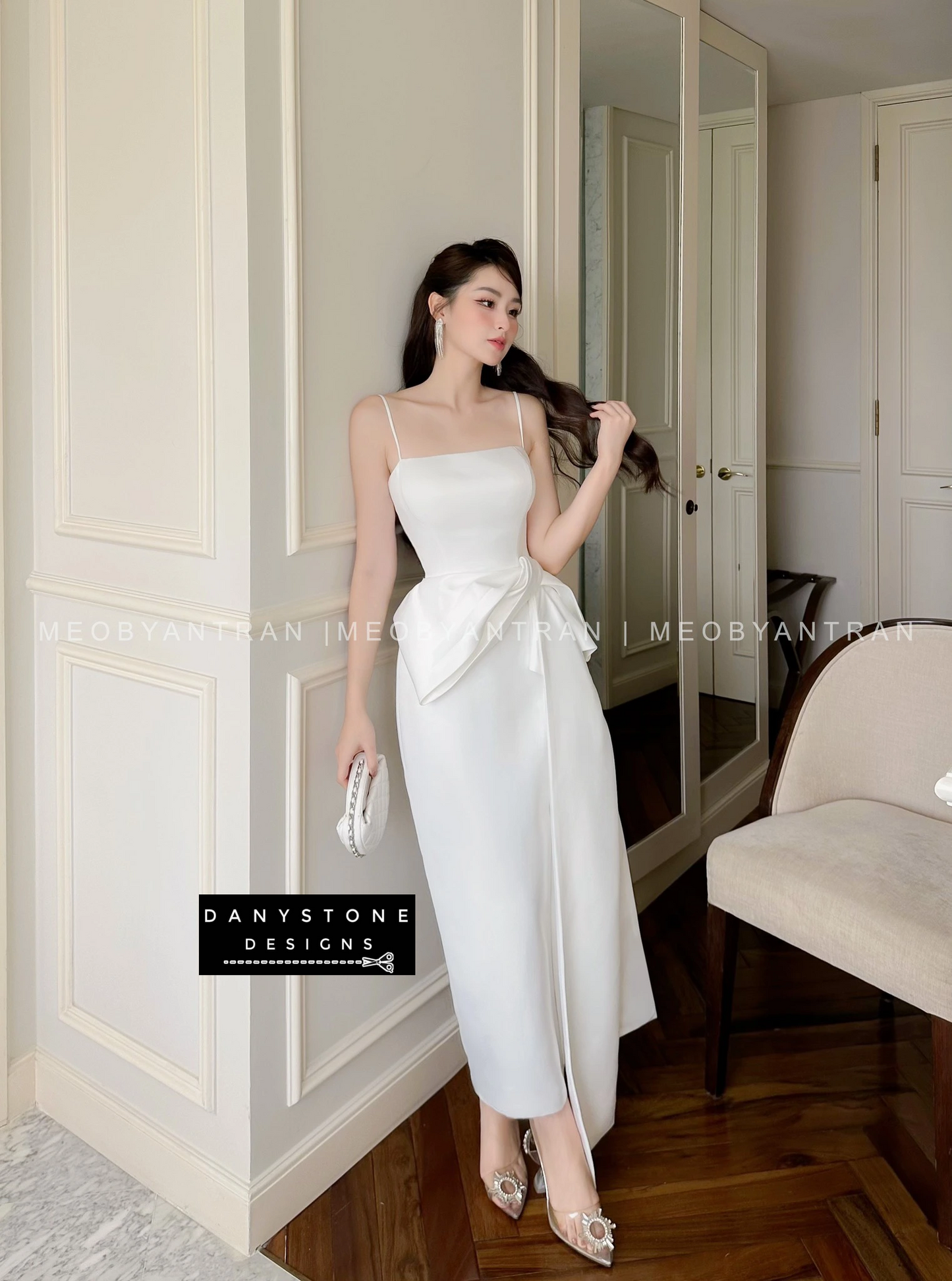 View of white 2-Strap Dress Showcasing Bow Detail and Fabric Texture