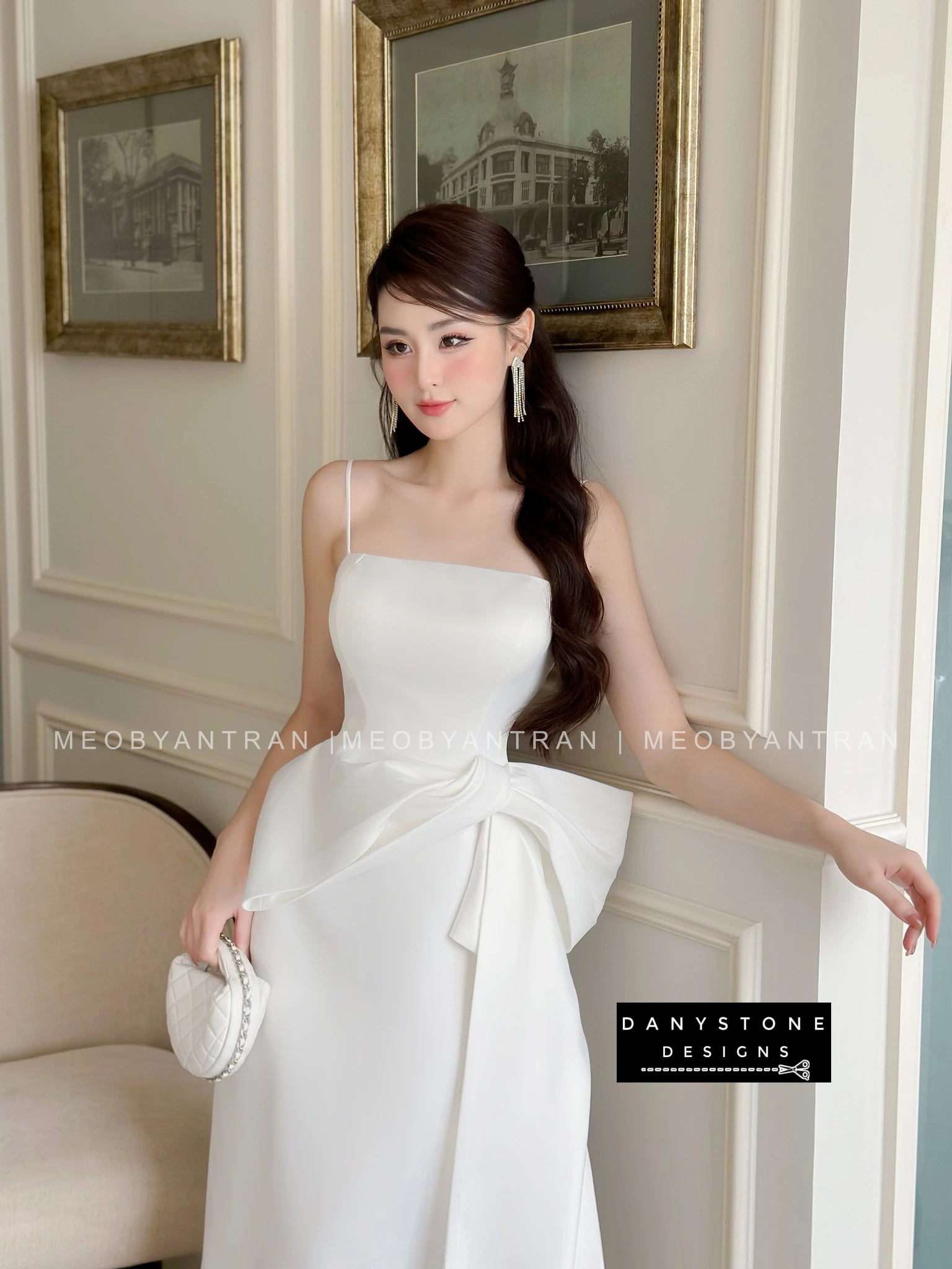 Model in White 2-Strap Wedding Party Dress with Bow Accent in Minimalist Setting