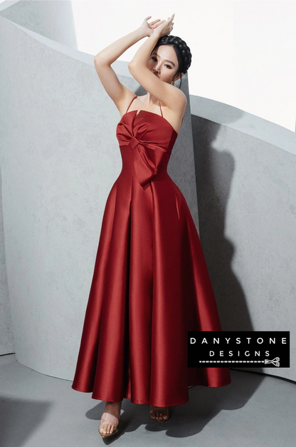 Model in Red 2-Strap Dress with Bow Accent at Waist