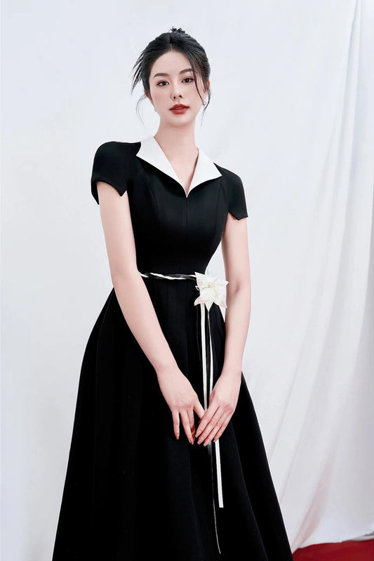 Classic A-line short-sleeved black dress with white collar front view