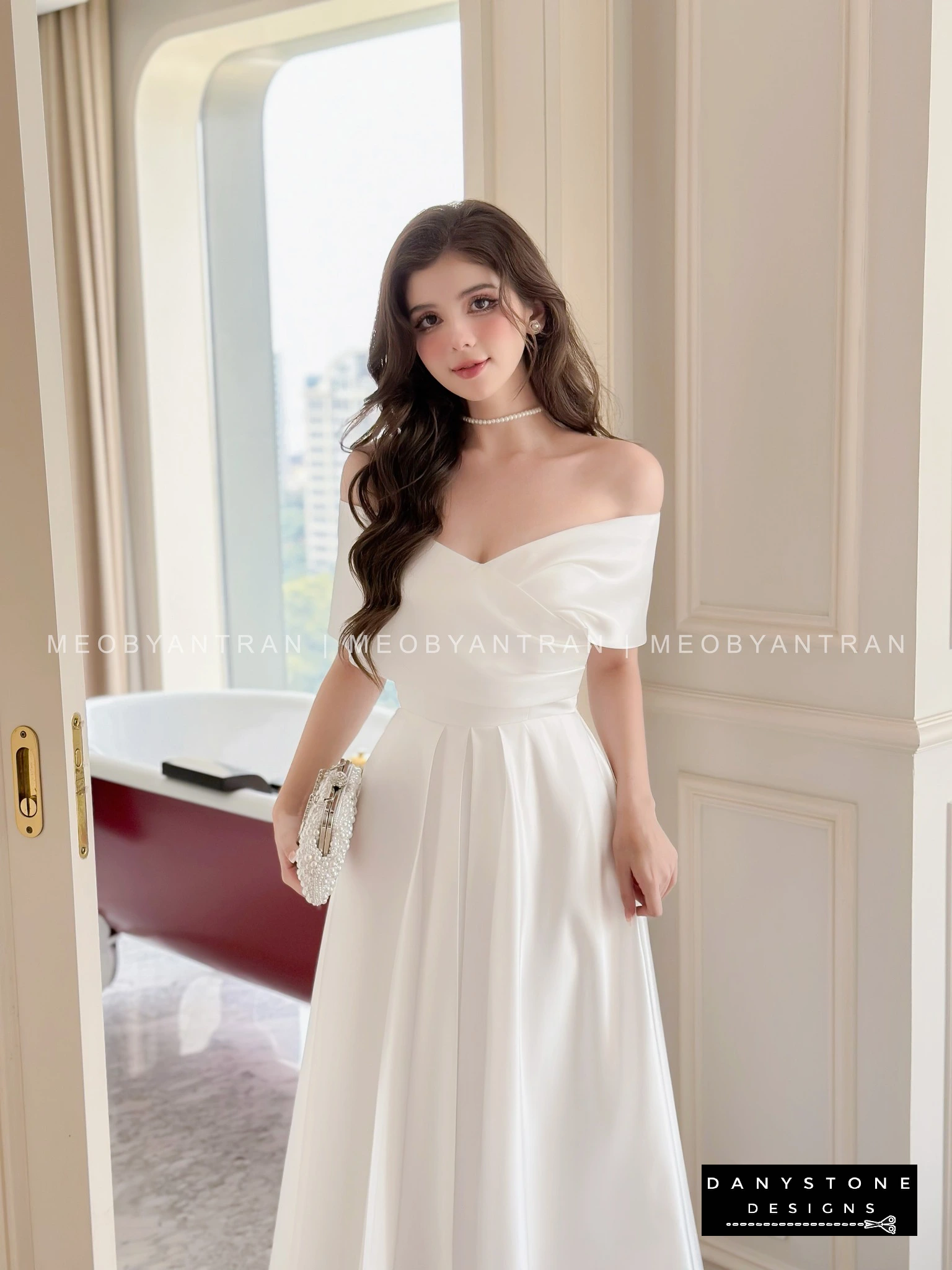 View of White Off-Shoulder Dress Showcasing Silky Fabric and Elegant Design