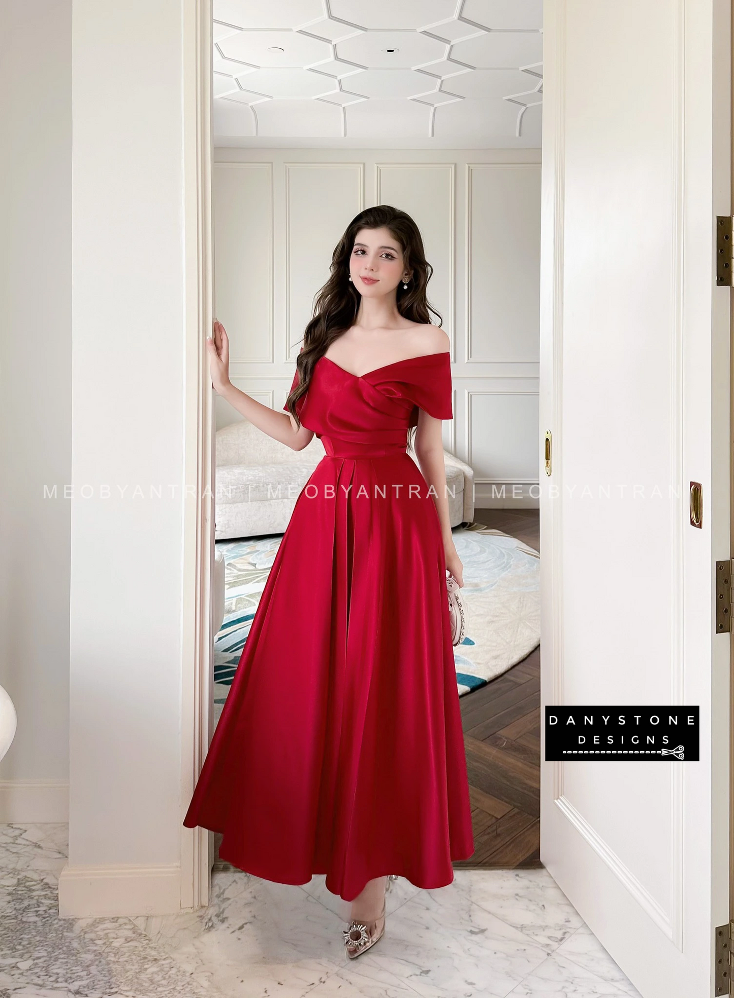 Model in Red Off-Shoulder Party Dress in Luxurious Setting