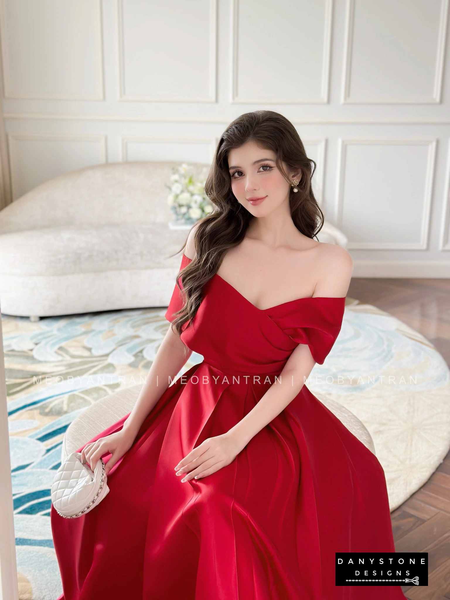 Model Posing in White Off-Shoulder Party Dress with Accessories