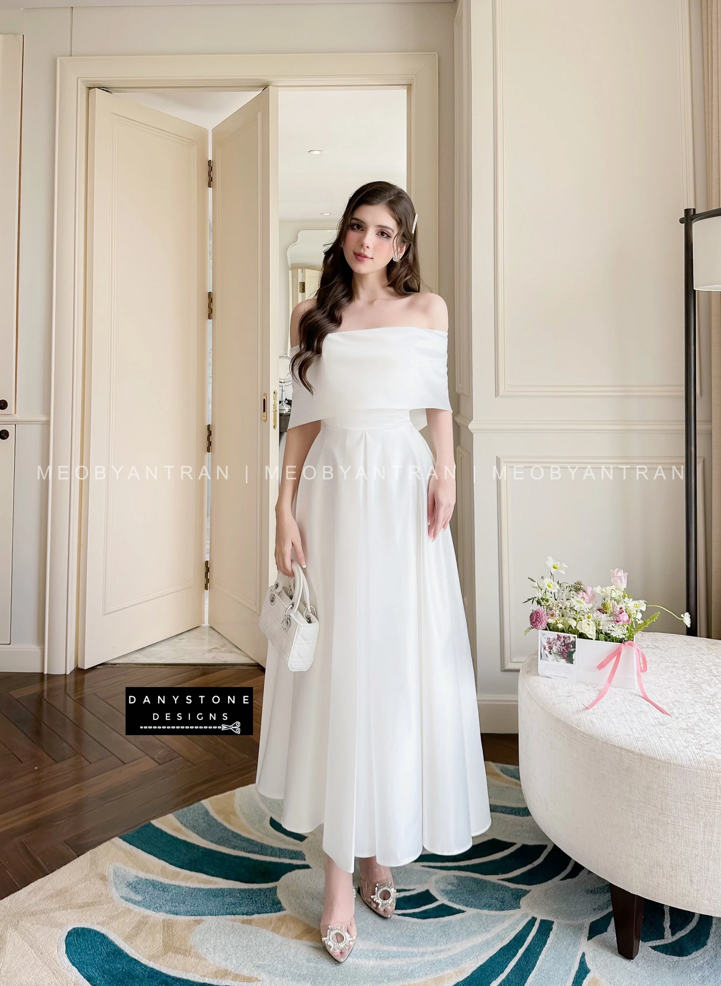  View of White Off-Shoulder Dress Highlighting Flowing Silhouette