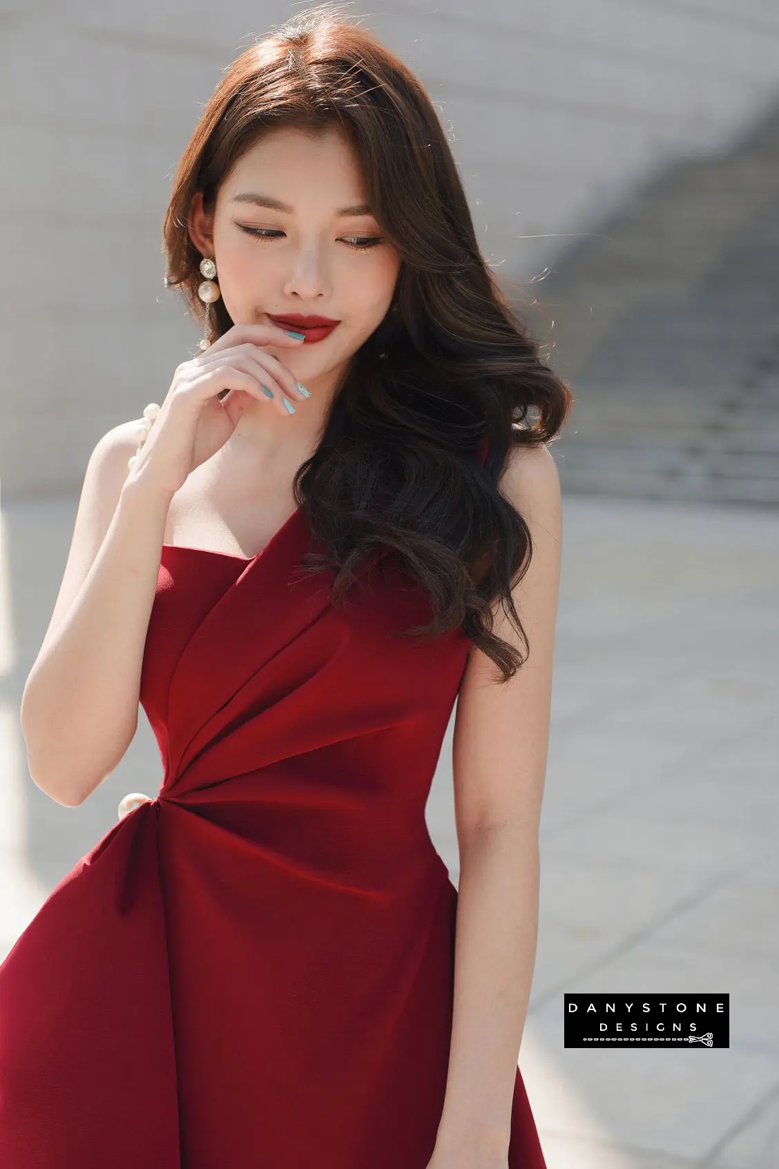 Model Wearing Red One-Shoulder Pearl Strap Flared Dress