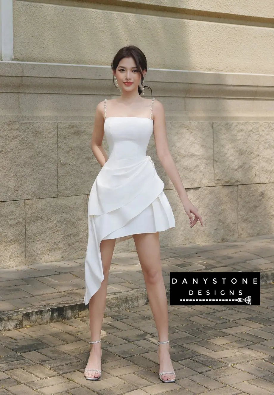 Side View of White Pearl Strap Dress Highlighting Asymmetrical Skirt