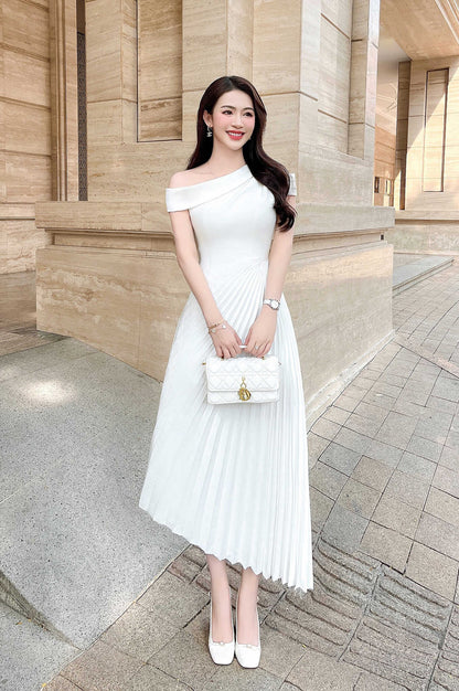 White off-shoulder dress paired with accessories