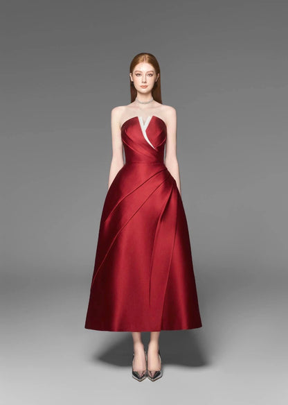 Elegant red strapless pleated dress side profile