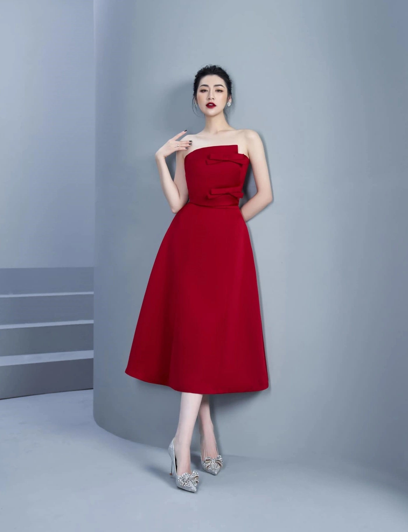 Side profile of red strapless A-line dress