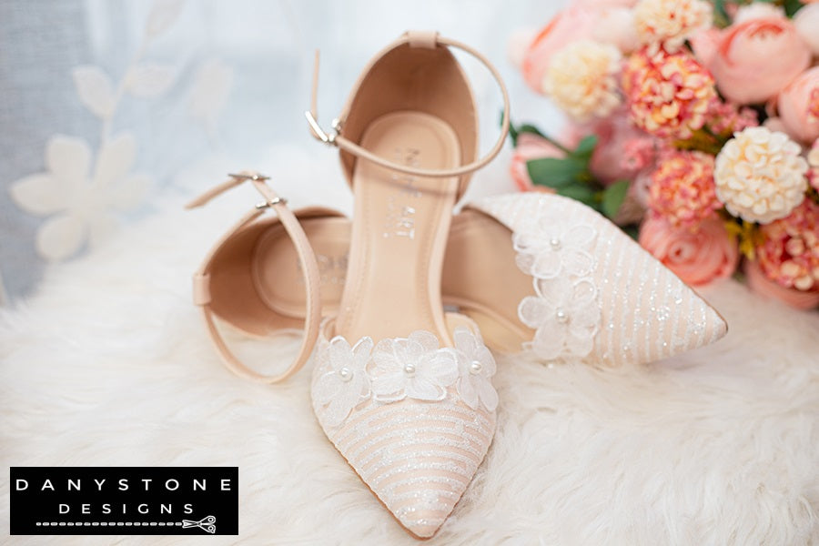 White handmade lace bridal shoes with 9cm heel, featuring floral decorations and metallic lace fabric.