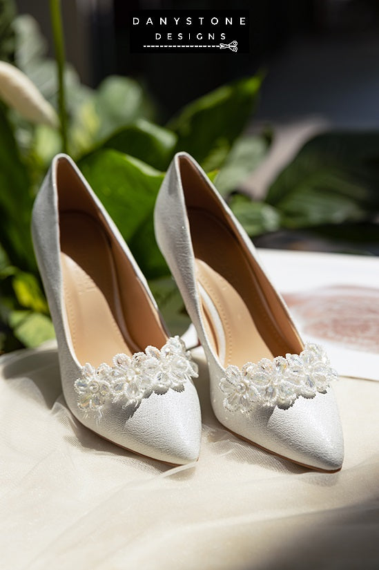 "Pair of 10cm wedding shoes with white crystal bead flowers displayed on a soft surface"