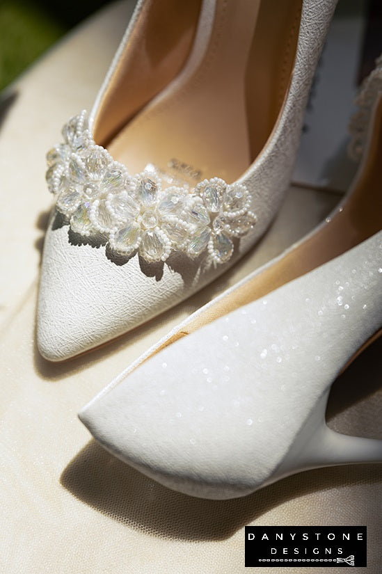 "Side view of 10cm crystal beaded wedding shoes with white crystal flower petals decoration"