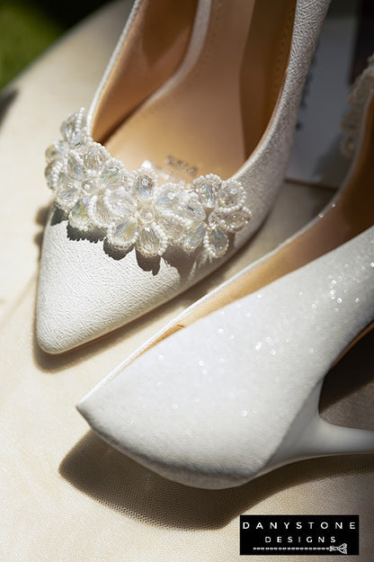 "Side view of 10cm crystal beaded wedding shoes with white crystal flower petals decoration"