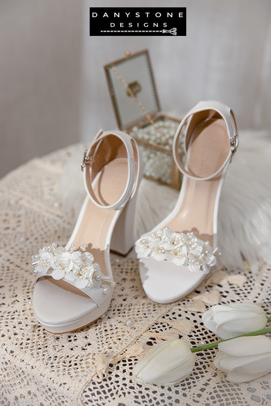 Close-up of the floral and pearl design on Elegant White Matte Leather Wedding Sandals.