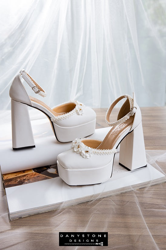 White double square toe high heels with floral trim and 13cm heel, crafted from matte white leather, perfect for weddings.