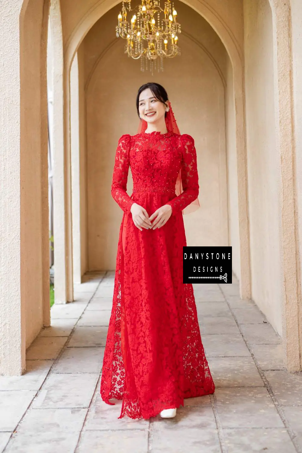 Close-up of the Red Lace Bridal Ao Dai's pearl embellishments on the back, emphasizing its luxurious and noble beauty.