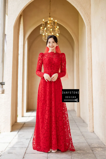 Front view of a stunning Red Lace Bridal Ao Dai adorned with pearls, showcasing its detailed craftsmanship and sophisticated look.