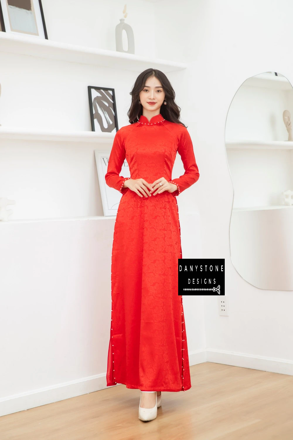 Front view of a bride wearing the Red Brocade Bridal Ao Dai, capturing the simple yet elegant traditional design.