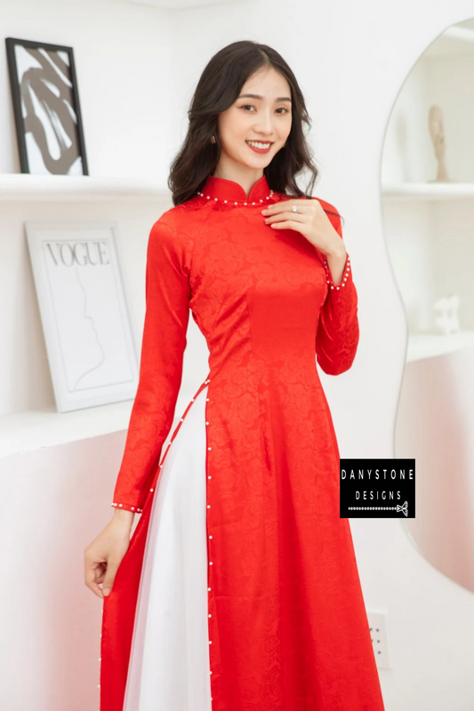 Side view of a bride in a Red Brocade Bridal Ao Dai with a 4-panel jade border, highlighting the elegant design and soft brocade fabric.