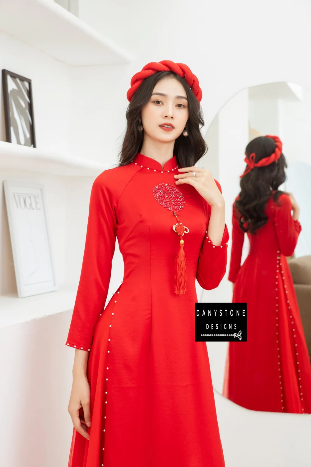 Detailed shot of the pearls along the hem of the Bright Red Silk Wedding Ao Dai, showcasing its elegant and prominent design.