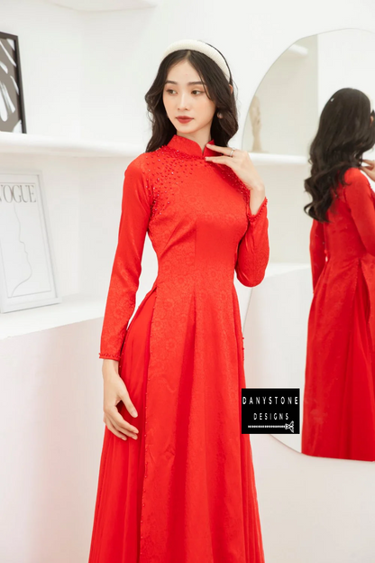 Full-length view of the Red Brocade Ao Dai, emphasizing the 4-flap design and graceful flow.