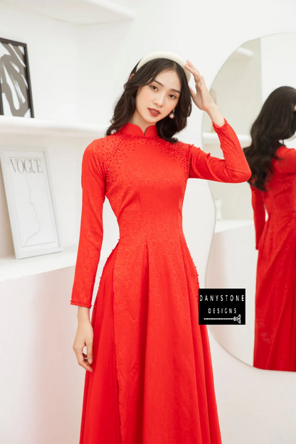 Side view of the Red Brocade Ao Dai, capturing the luxurious brocade fabric and elegant design.