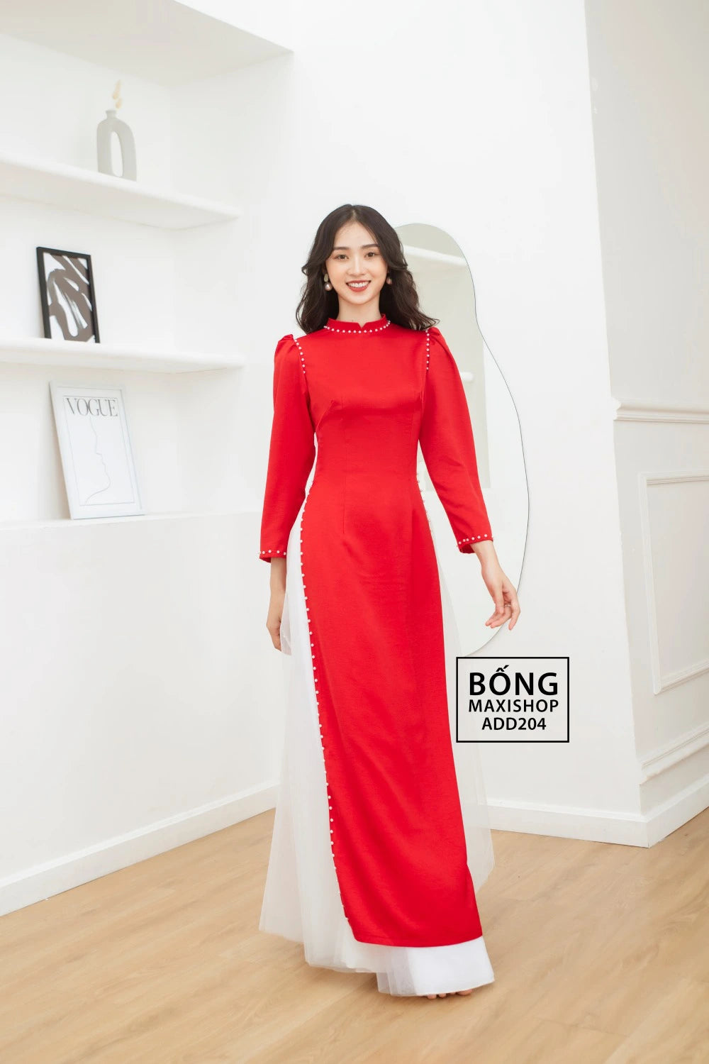 Bride smiling in the Red Silk Bridal Ao Dai, illustrating the elegant and graceful beauty of the dress.