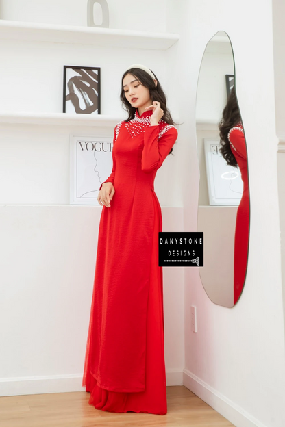 Side view of the Red Silk Bridal Ao Dai, capturing the soft fabric and delicate pearl embellishments.