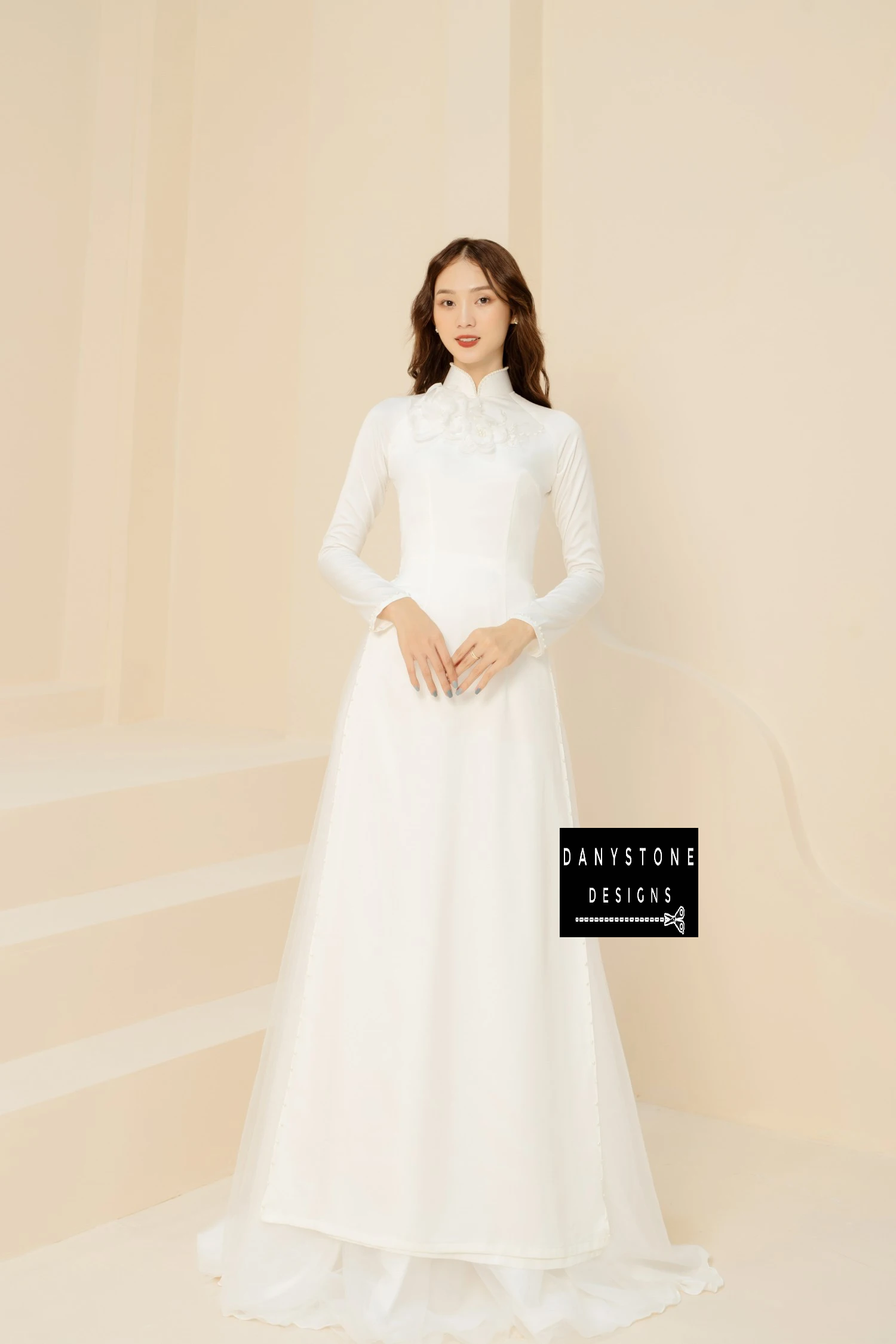 Bride smiling in the White Silk Bridal Ao Dai, illustrating the elegant and sophisticated beauty of the dress.