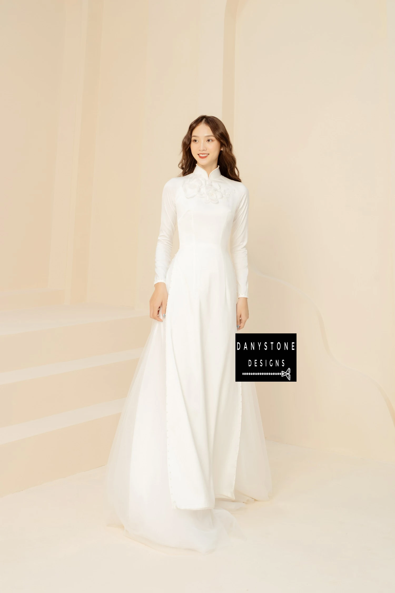 Side view of the White Silk Bridal Ao Dai, emphasizing the soft silk fabric and delicate floral embellishments.