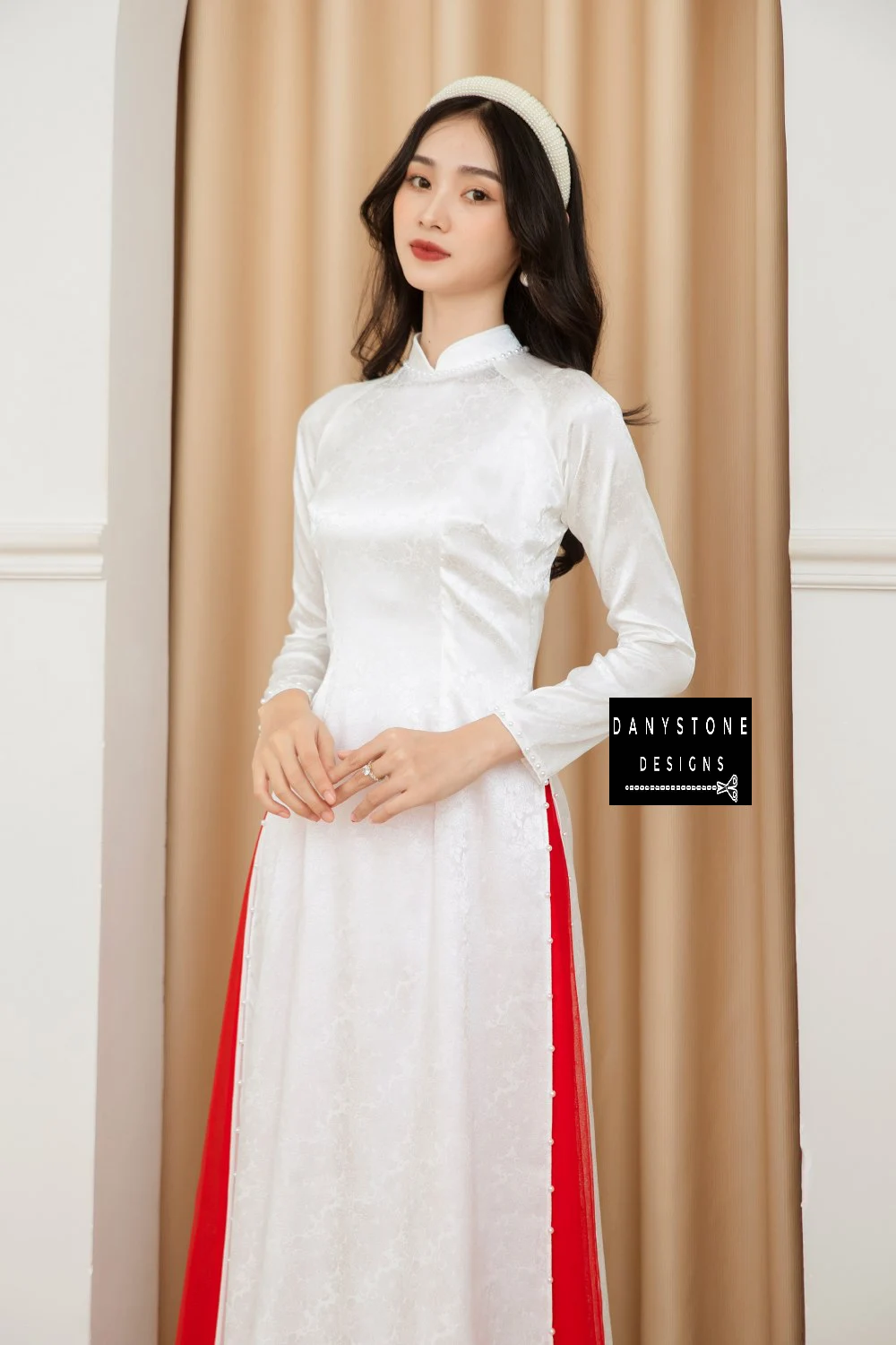 Front view of the Pure White Brocade Ao Dai with jade border, emphasizing the clean lines and elegant design.