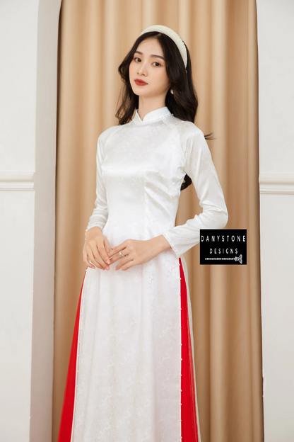 Front view of the Pure White Brocade Ao Dai with jade border, emphasizing the clean lines and elegant design.