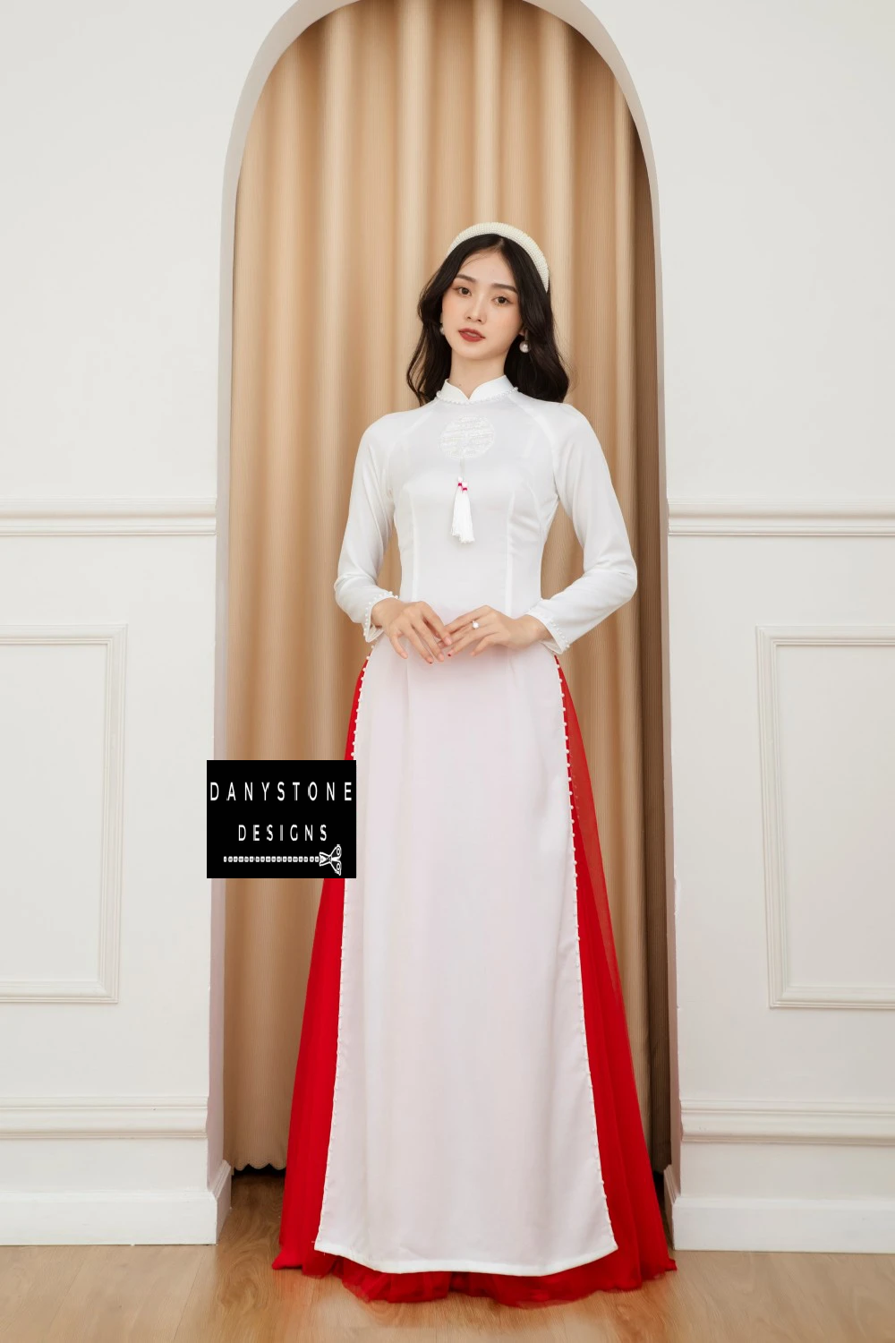 Side profile of a bride in the Elegant White Silk Wedding Ao Dai, highlighting the delicate silk fabric and pearl embellishments.