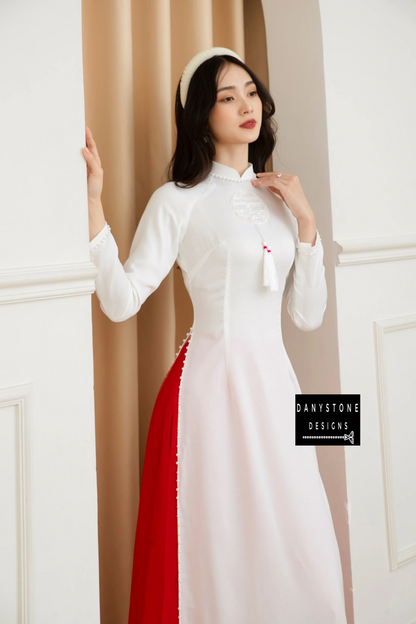 Front view of the Elegant White Silk Wedding Ao Dai, emphasizing the clean lines and elegant design with red accents.