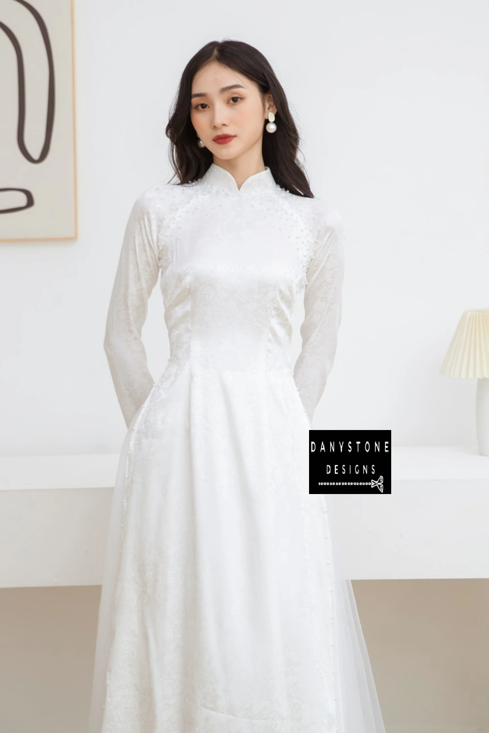 Front view of the Elegant White Brocade Bridal Ao Dai, emphasizing the clean lines and luxurious design.