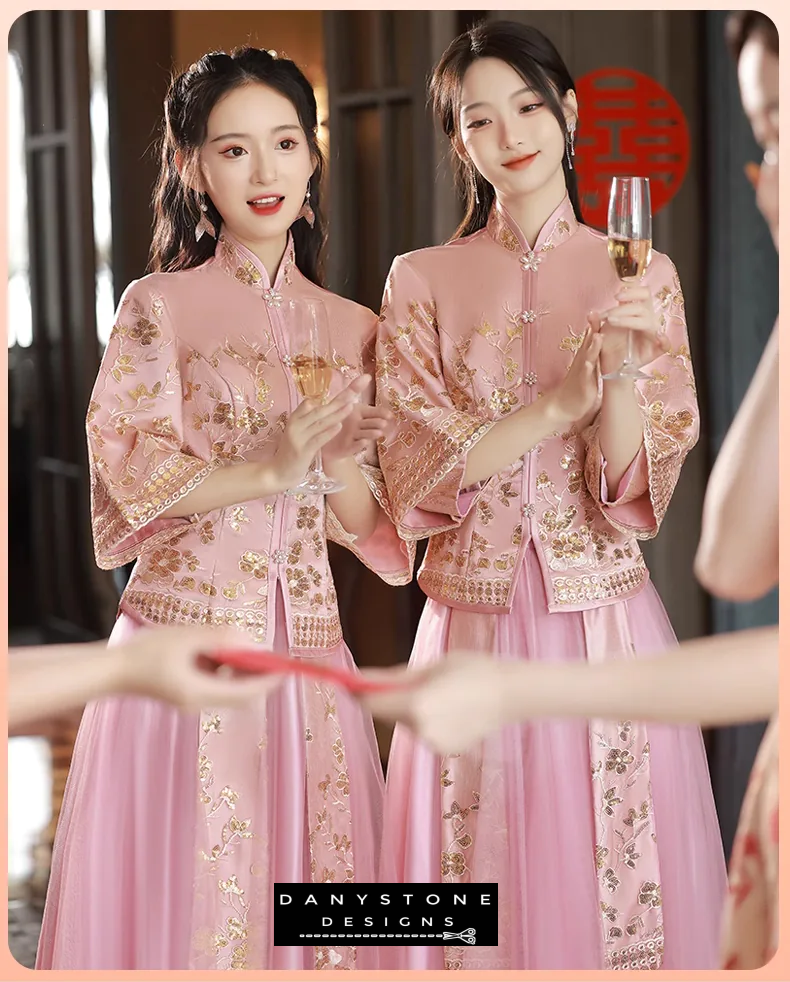 "Front view of the pink Xiuhe dress with detailed floral embroidery"