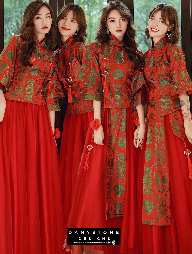 "Back view of a red formal gown with ornate green embellishments"