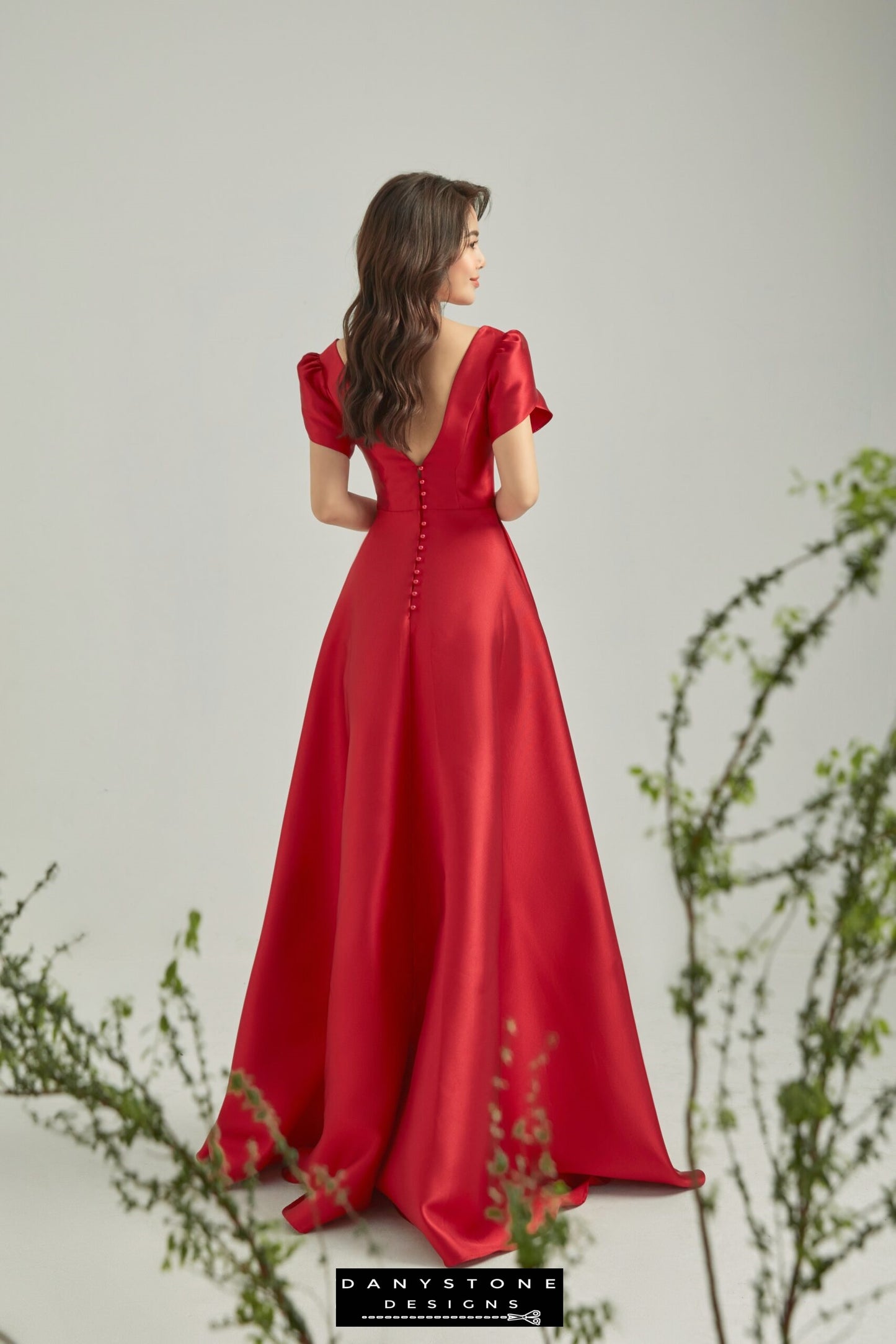 Red evening dress with short fairy wing sleeves perfect for formal occasions