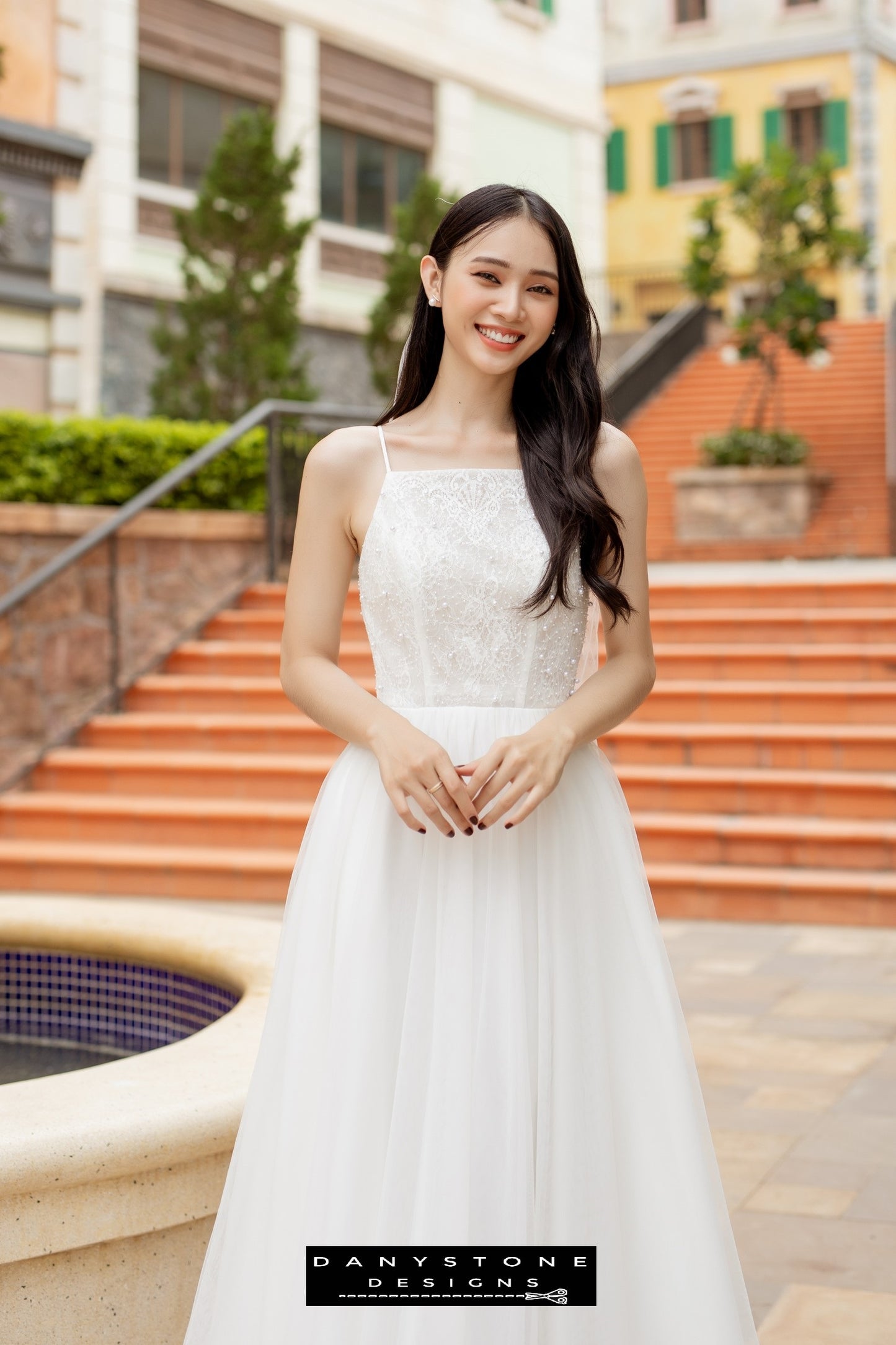 Image 3: Full-length view of a bride in a camisole wedding dress with mesh beads, showcasing the intricate details.