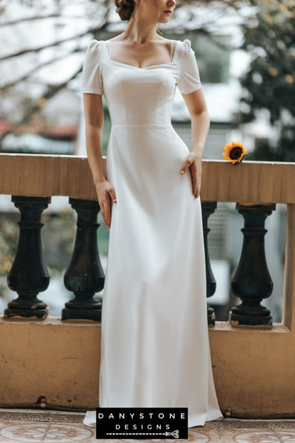 Sophisticated bride in backless wedding dress with square neckline and short sleeves – Danystone Designs